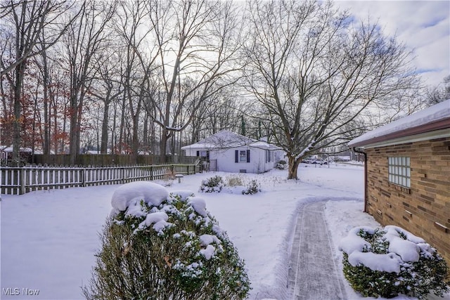 view of yard layered in snow