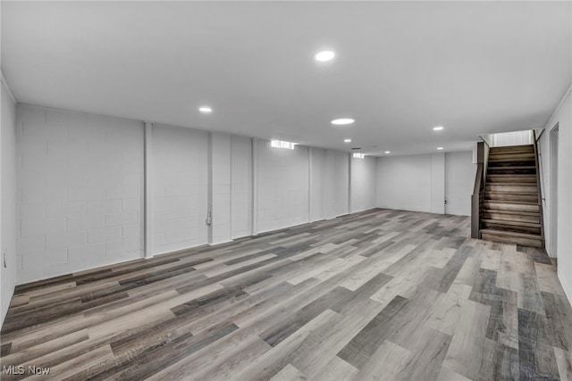 basement with hardwood / wood-style floors