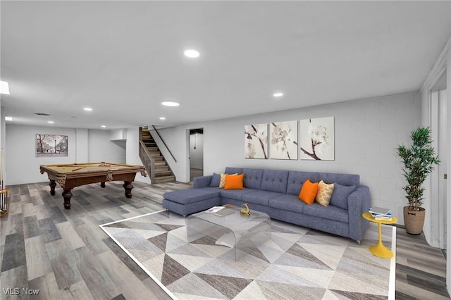 living room with pool table and light hardwood / wood-style flooring