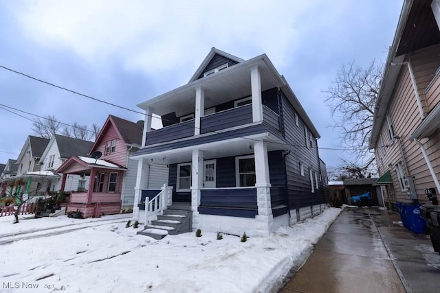 bungalow-style house featuring a balcony