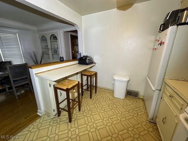 kitchen featuring white refrigerator