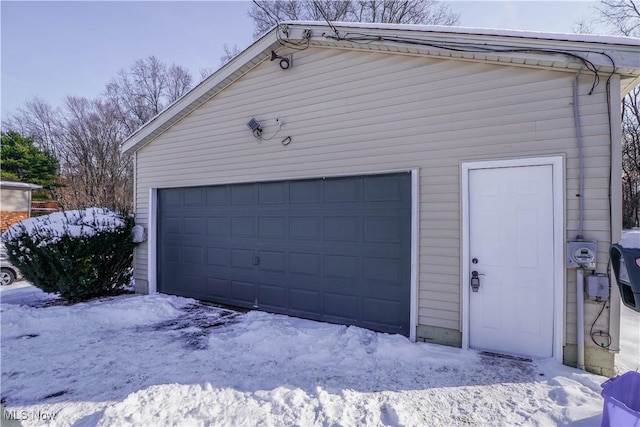 view of snow covered garage