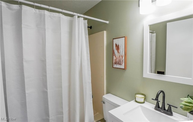 bathroom with toilet and sink