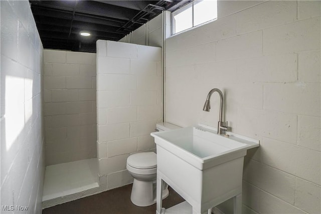 bathroom with toilet and walk in shower