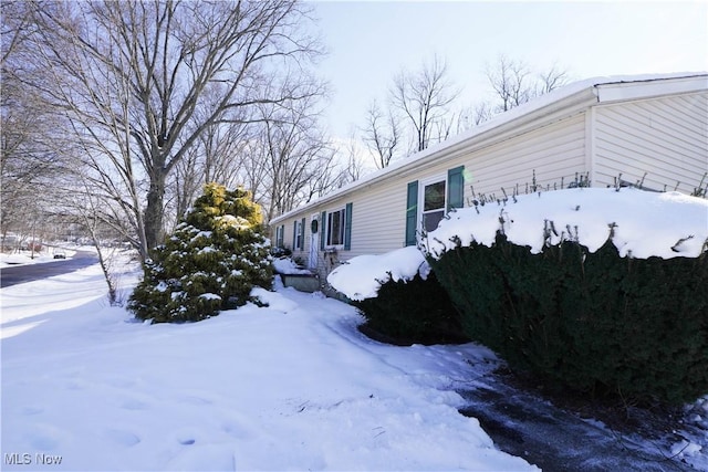 view of snow covered property