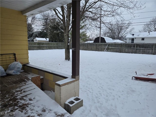 view of yard layered in snow