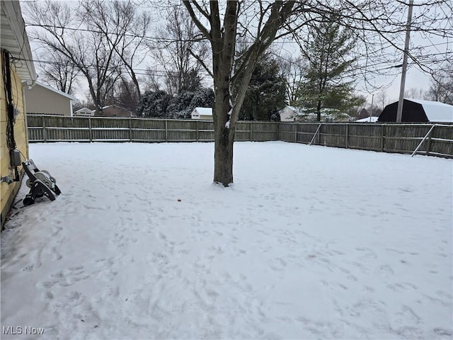 view of yard layered in snow