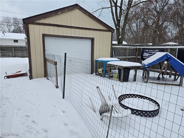 view of snow covered garage