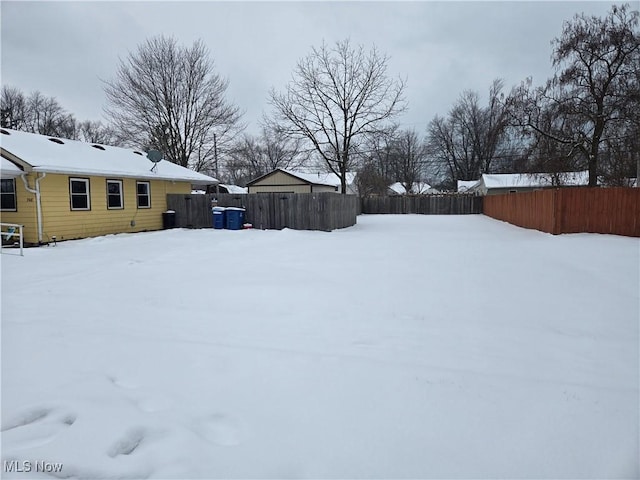 view of yard layered in snow