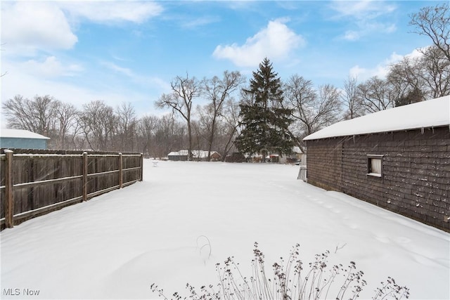 view of yard covered in snow