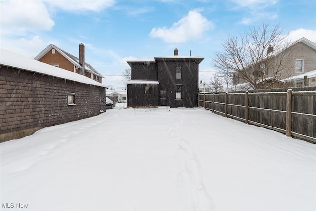 view of yard layered in snow