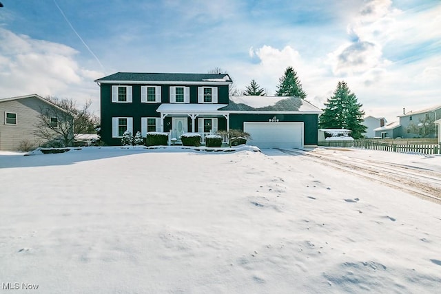 colonial inspired home featuring a garage