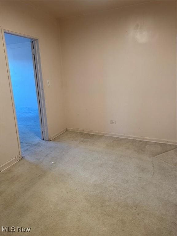 empty room with light colored carpet