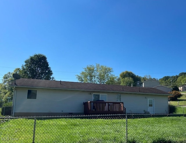 back of property with a yard, a fenced backyard, and crawl space