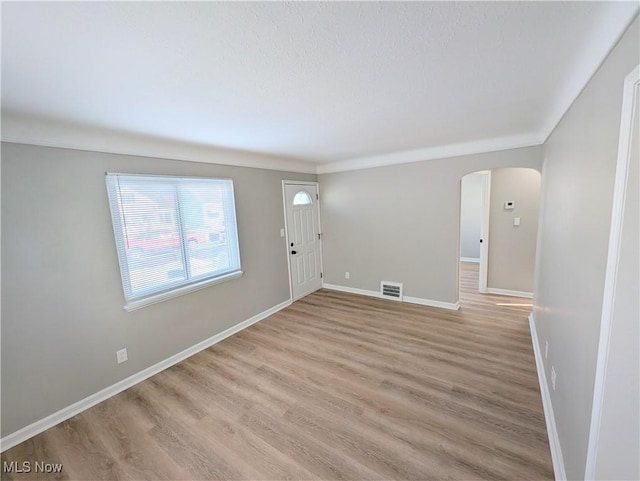 empty room with light hardwood / wood-style floors