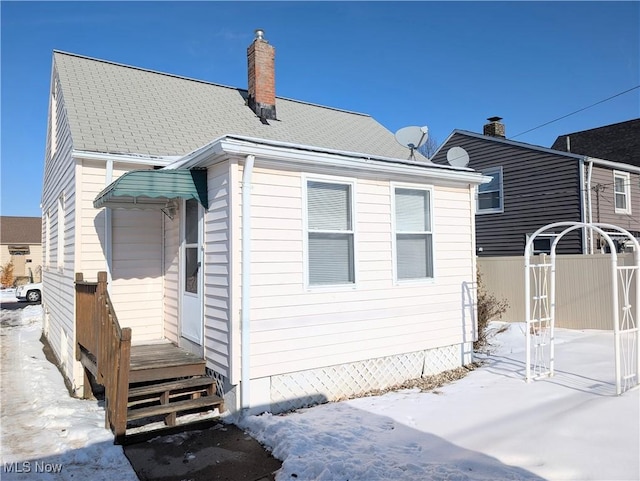 view of snow covered house