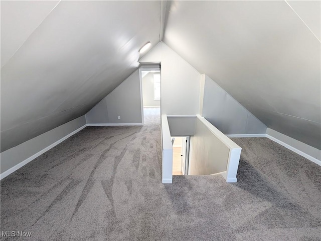 bonus room featuring carpet and lofted ceiling