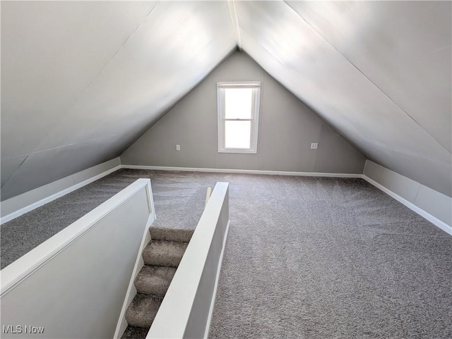 bonus room featuring carpet and lofted ceiling