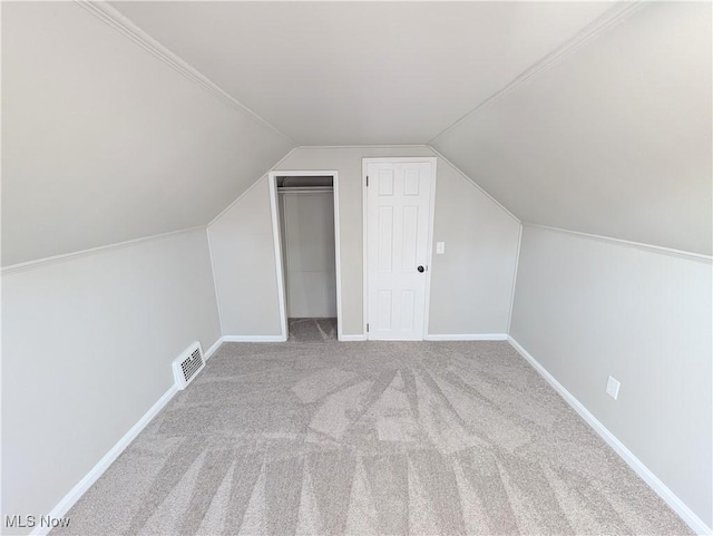 bonus room featuring carpet flooring and lofted ceiling