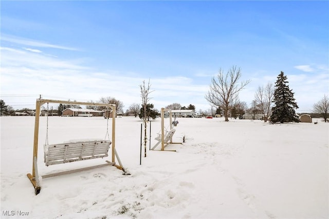 view of yard layered in snow