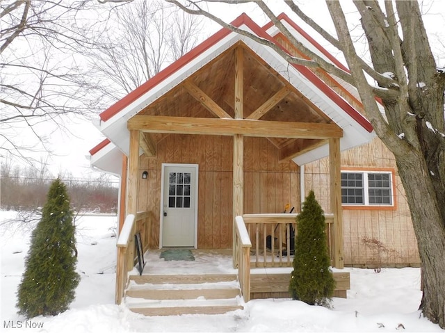 view of snow covered property entrance