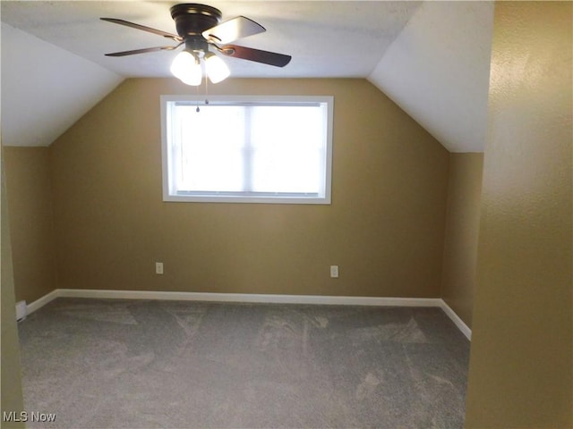 bonus room with vaulted ceiling, ceiling fan, and carpet flooring