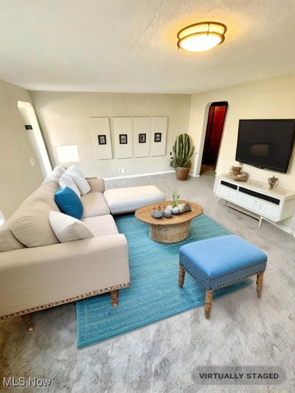 living room with a textured ceiling