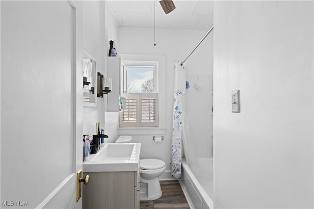 full bathroom with toilet, vanity, shower / bath combo, and hardwood / wood-style flooring