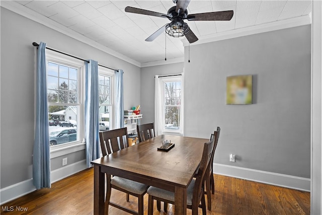 dining room featuring ceiling fan, dark hardwood / wood-style floors, and crown molding