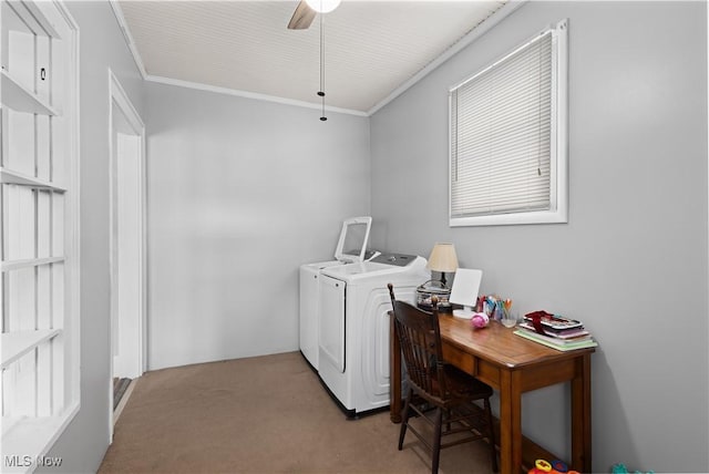 clothes washing area with ceiling fan, washing machine and dryer, light carpet, and crown molding