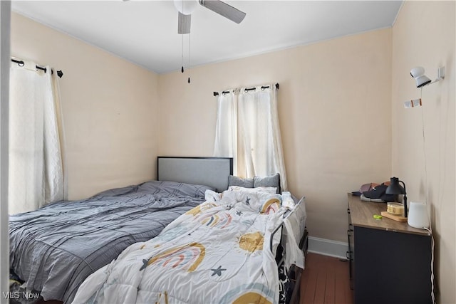 bedroom featuring ceiling fan and hardwood / wood-style floors