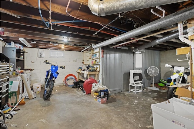 basement with heating unit and sink