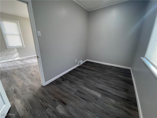 spare room featuring dark hardwood / wood-style floors