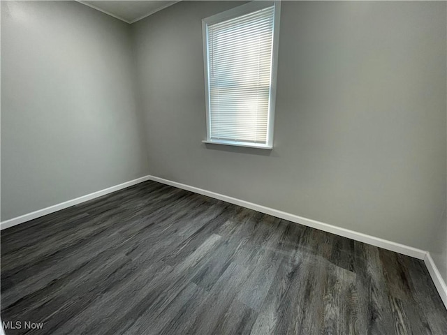 unfurnished room featuring dark hardwood / wood-style flooring