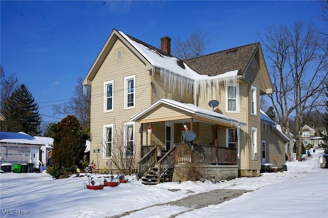 view of property featuring covered porch