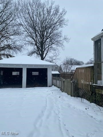 view of yard layered in snow