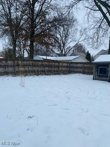 view of yard covered in snow