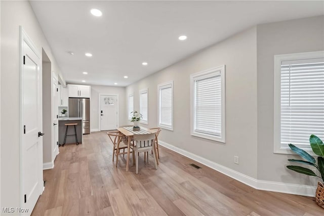 dining space featuring light hardwood / wood-style floors