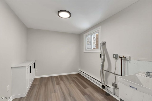 laundry area with sink, hookup for a washing machine, and hardwood / wood-style floors