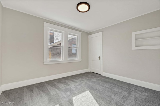 empty room with carpet flooring