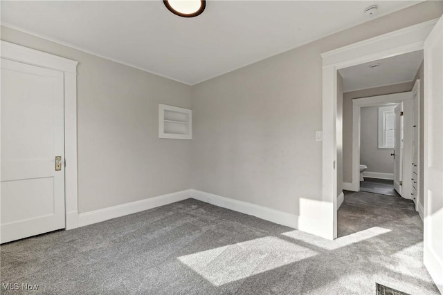 empty room with carpet flooring