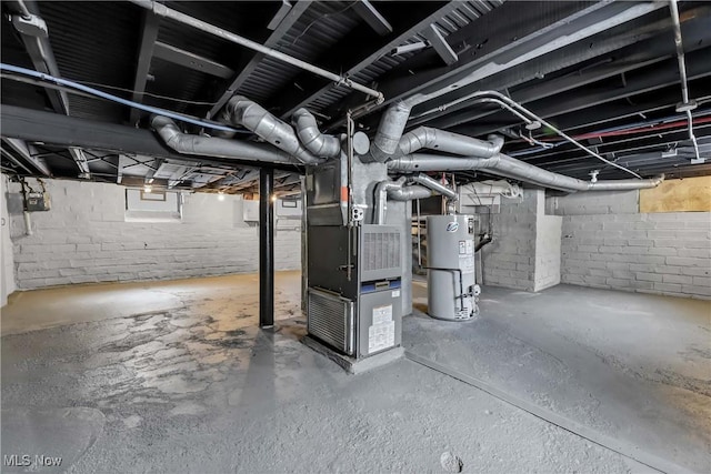 basement featuring heating unit and water heater