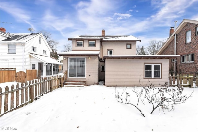 view of snow covered property