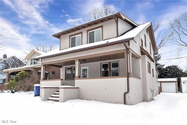 view of front of home with covered porch and a garage