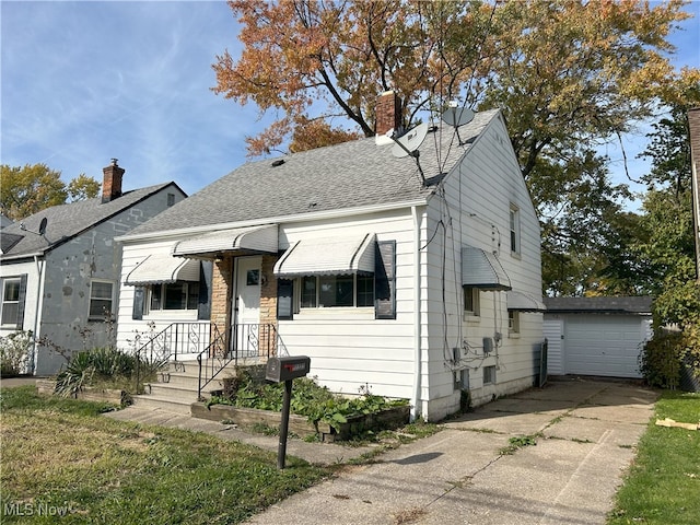 bungalow with an outbuilding and a garage