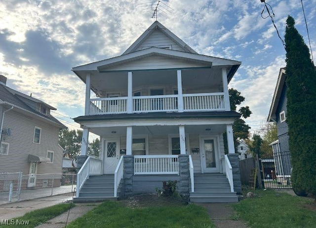 view of front of home with a porch and a balcony