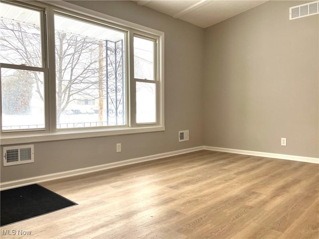 unfurnished room featuring light wood-type flooring