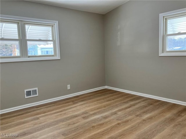 unfurnished room featuring hardwood / wood-style floors