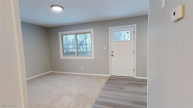 entryway with light hardwood / wood-style floors