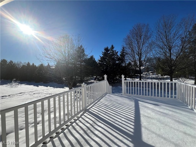 view of snow covered deck